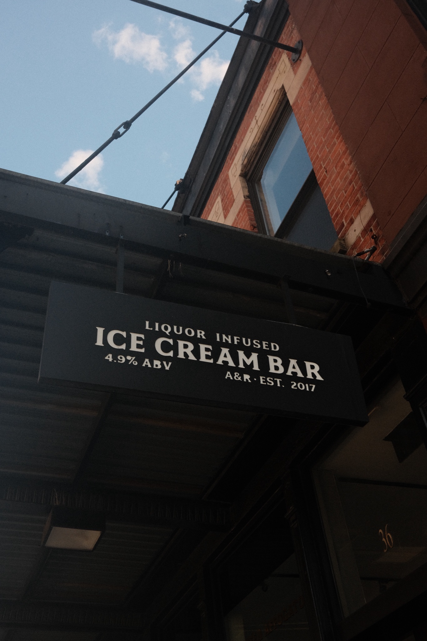 Liquor infused ice cream bar hanging sign