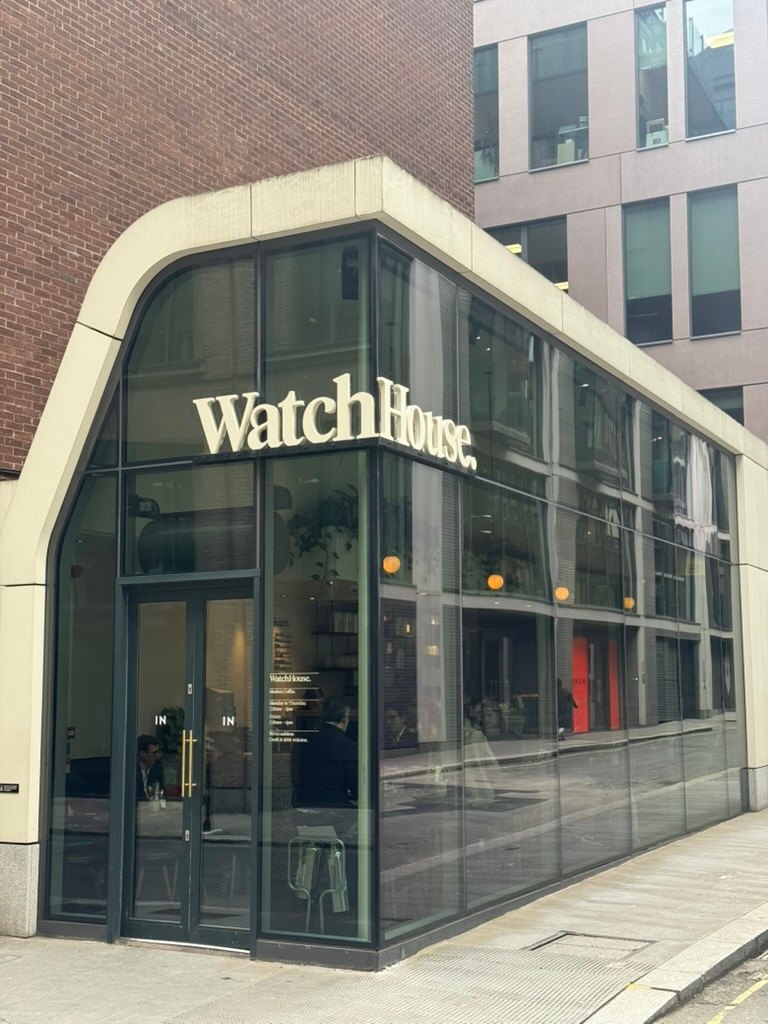 WatchHouse serif letters on a curved glass corner