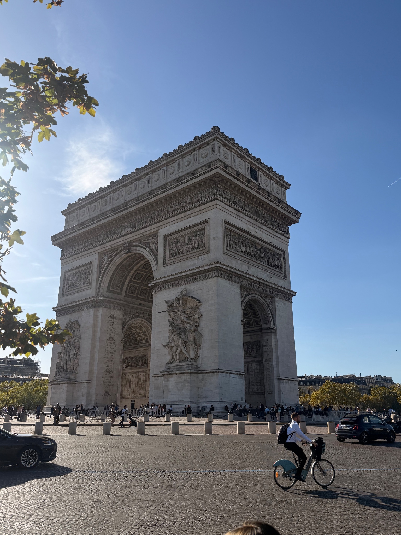 Arc de Triomphe with passing Vélib' cyclist, Paris