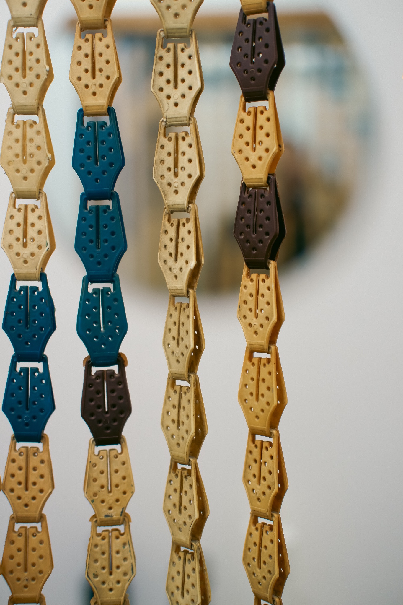Cream, teal and brown plastic chain fly curtain