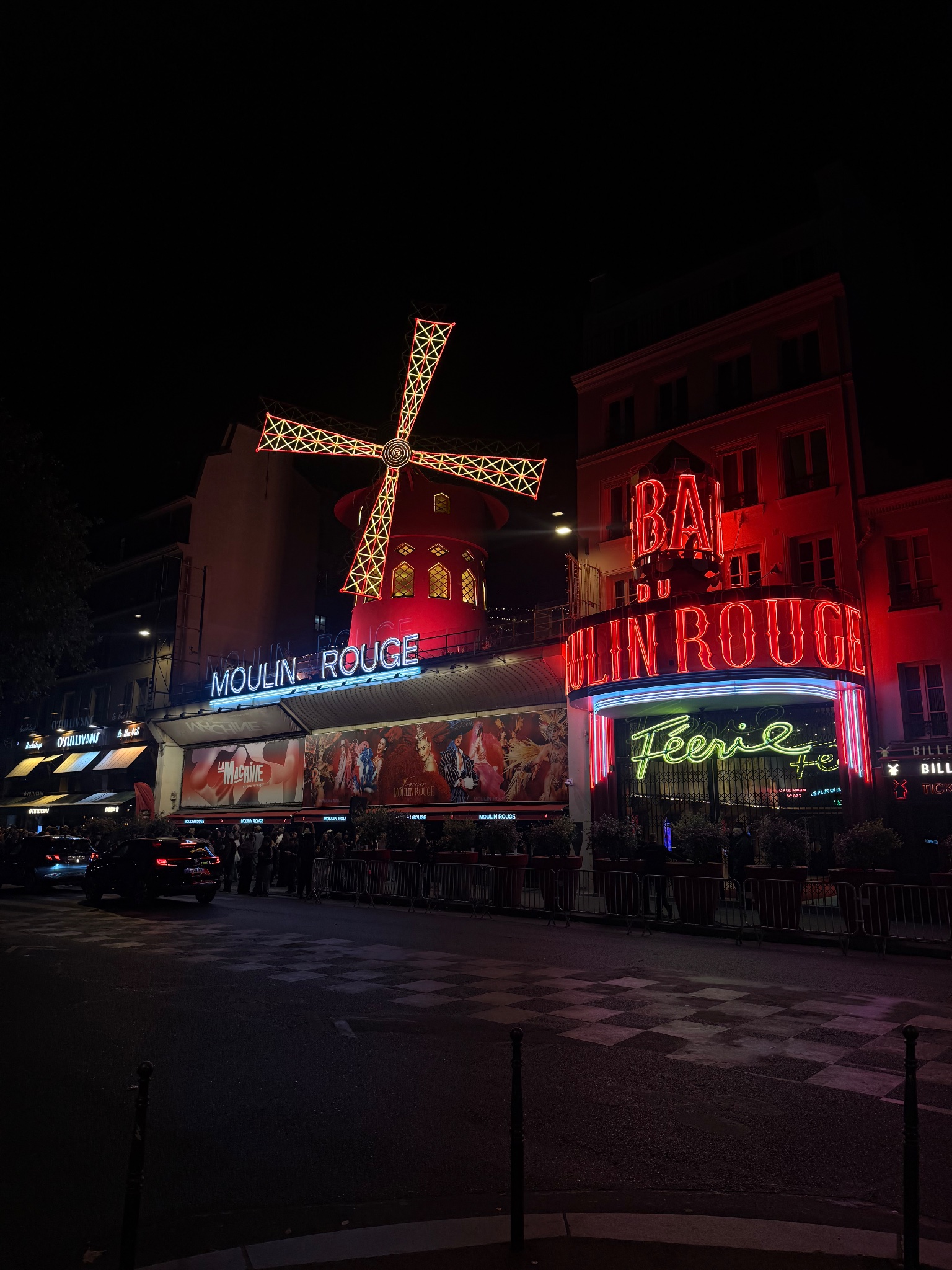 Moulin Rouge neon windmill and Bal signage, Paris