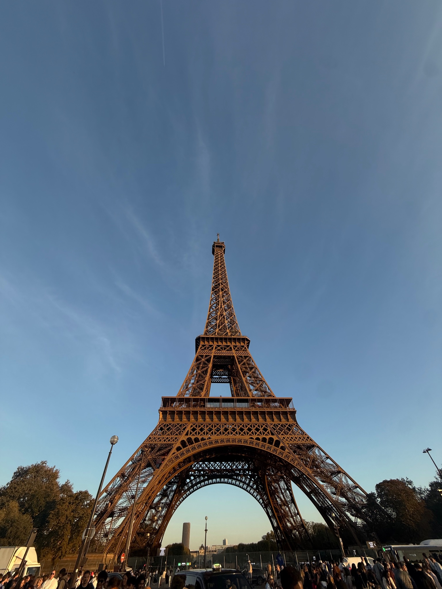 Eiffel Tower ironwork glowing at golden hour