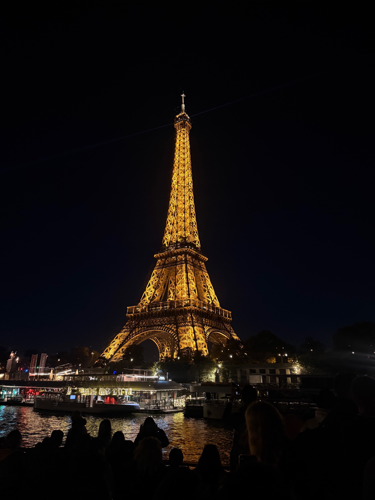 Golden lattice of the Eiffel Tower at night