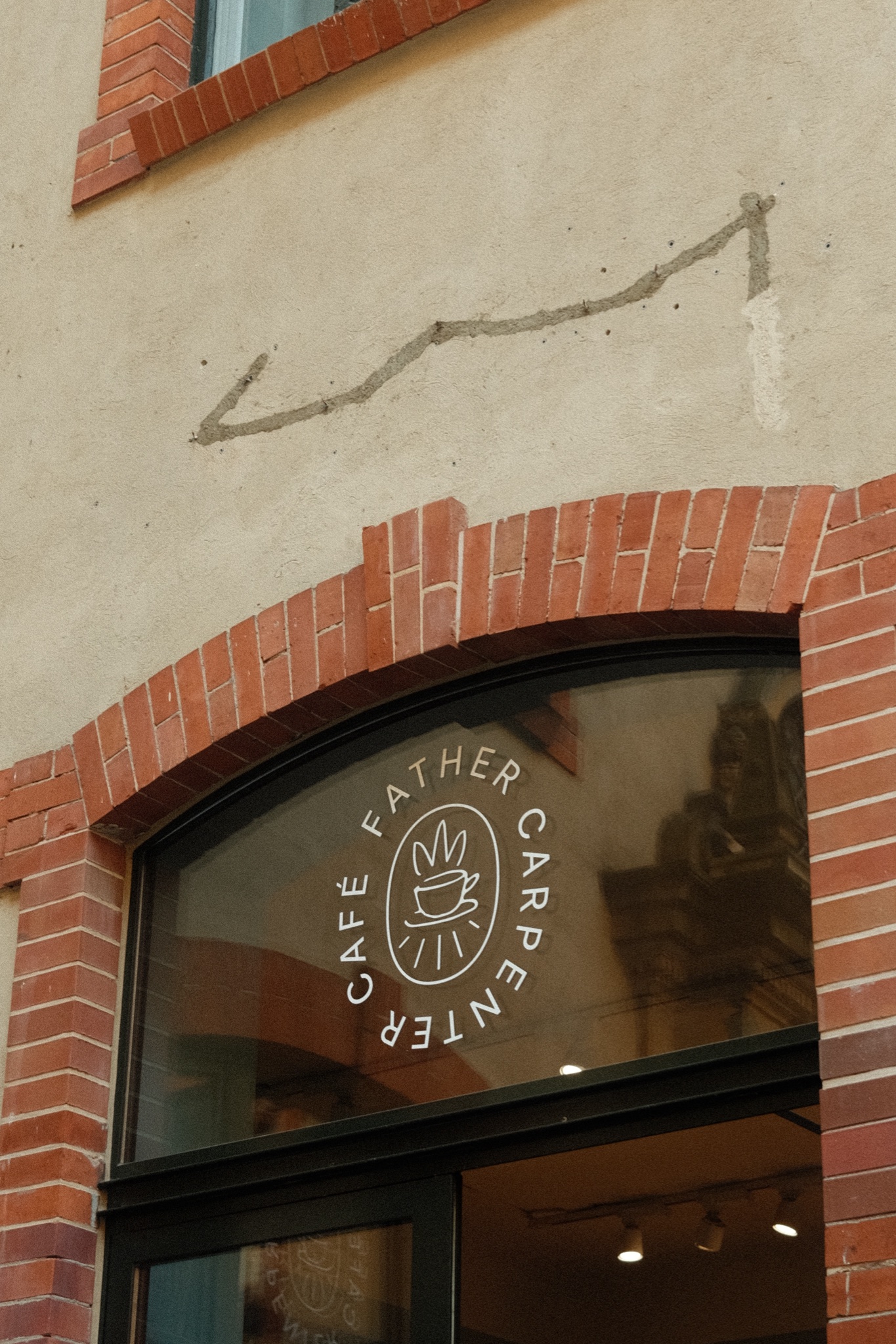 Father Carpenter Café circular window logo