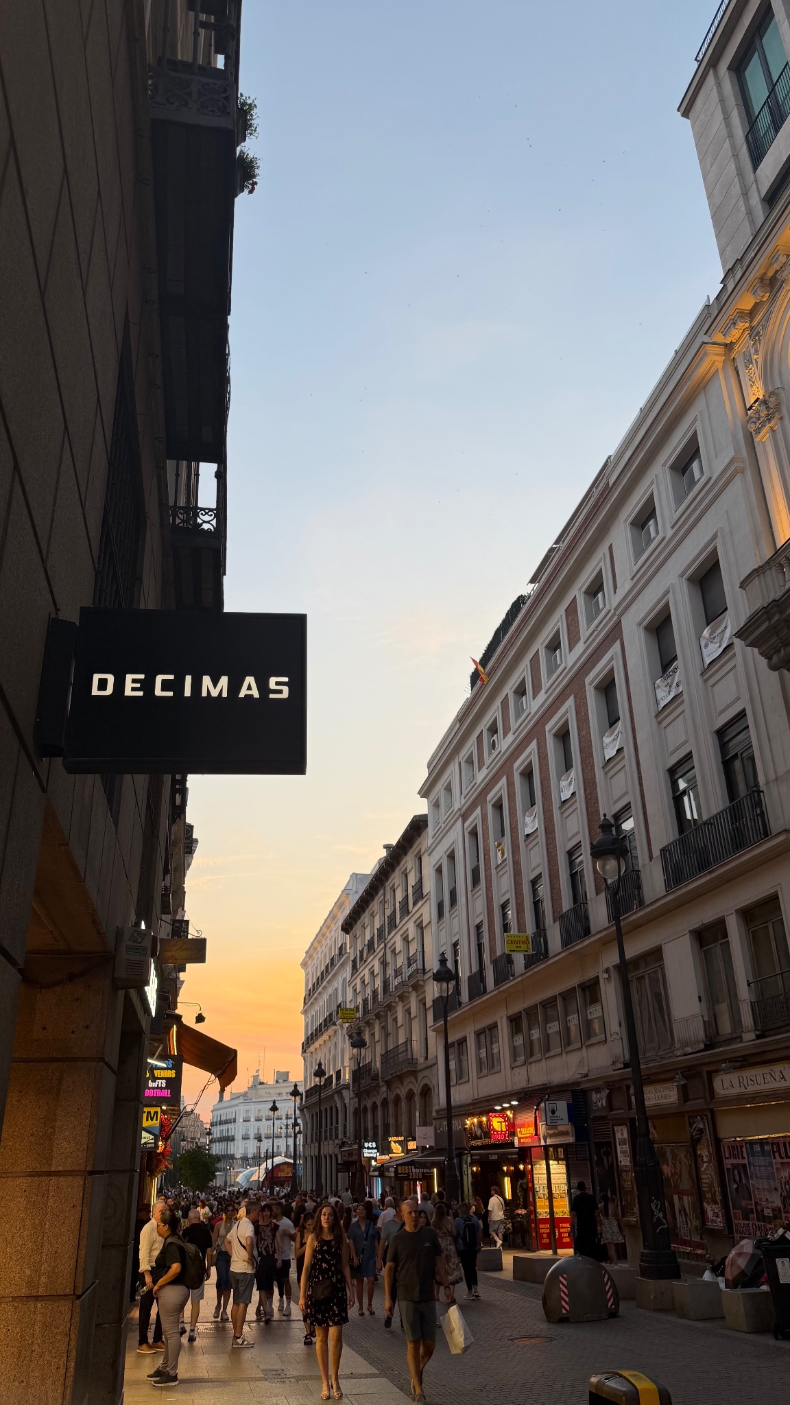 Decimas projecting sign at dusk, Madrid